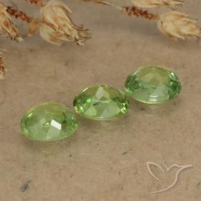 Shop natural 0.86ct イエローグリーン デマントイドガーネット gems, 楕円形, from ナミビア at GemSelect. In stock, global shipping!