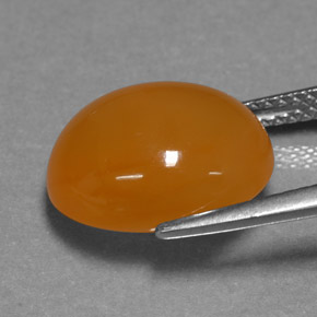 6.07カラットの天然オレンジファイアオパール、オーバルカット、半透明