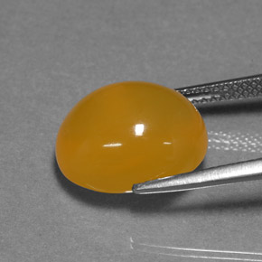 6.94カラットの天然イエローオレンジファイアオパール、オーバルカット、半透明