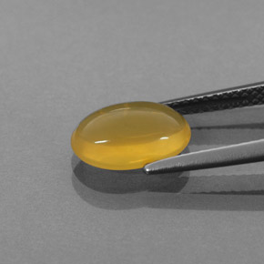 1.54カラットの天然イエローオレンジファイアーオパール（10.2×6.7 mm・透明）