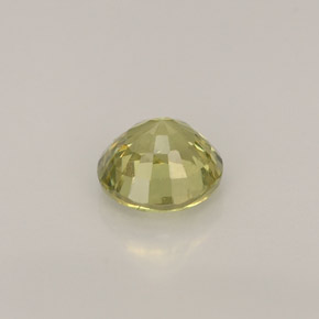 0.56カラットの天然緑がかったゴールドグロッシュラーガーネット（4.82 mm・ラウンドカット）