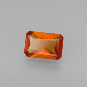 0.56カラットの天然マンダリンオレンジヘソナイトガーネット（6.1×4.2 mm・エメラルドカット）