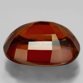 22.77カラットの天然シナモンオレンジヘソナイトガーネット（19.3×14.6 mm・オーバルカット）