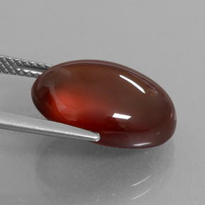 12.33カラットの天然オレンジヘソナイトガーネット、オーバルカット、半透明