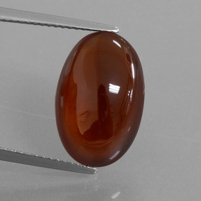 10.15カラットの天然オレンジヘソナイトガーネット（16.7×10.8 mm・オーバルカット）