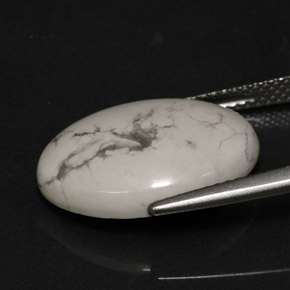 8.21カラットの天然灰色がかった白ハウライト、オーバルカット、オペーク