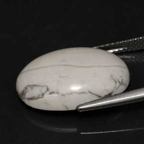 9.46カラットの天然灰色がかった白ハウライト、オーバルカット、オペーク