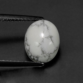 2.60カラットの天然灰色がかった白ハウライト、オーバルカット、オペーク