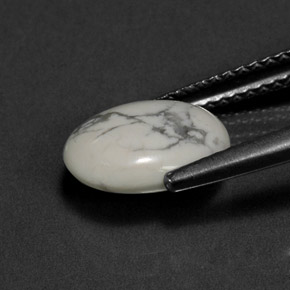 2.28カラットの天然灰色がかった白ハウライト、オーバルカット、オペーク