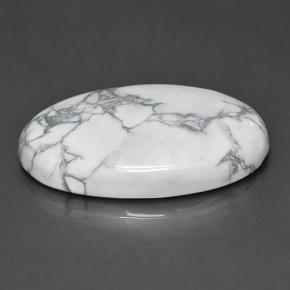63.57カラットの天然灰色がかった白ハウライト（39.1×24.8 mm・オーバルカット）