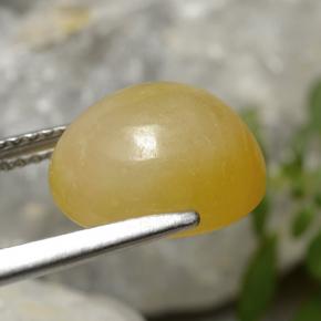 7.08カラットの天然イエローゴールデンジェダイト、オーバルカット、半透明