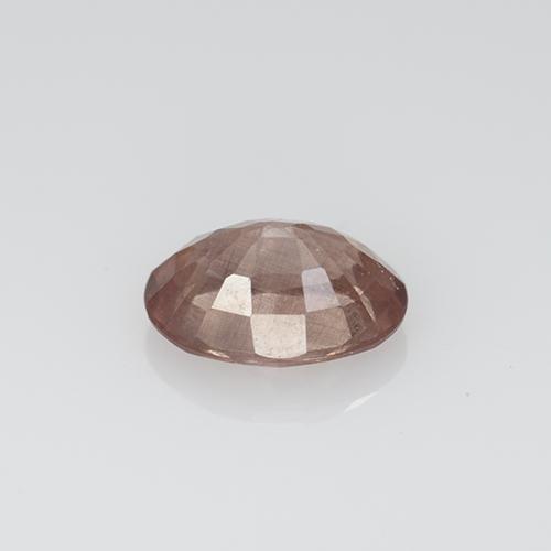 0.57カラットの天然薄いローズウッドピンクマレーシア産ガーネット、オーバルカット、VS-SI