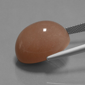 24.57カラットの天然サイダーオレンジムーンストーン、オーバルカット、オペーク