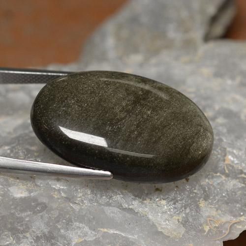 26.24カラットの天然ゴールドシーンのあるブラックオブシディアン（28.5×18.2 mm・オーバルカット）