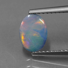 0.69カラットの天然マルチカラーダブレットオパール、楕円形、オペーク