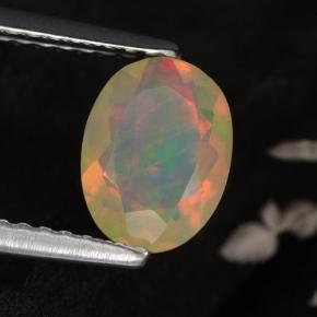 0.67カラットの天然イエローオパール（8×6 mm・オーバルカット）