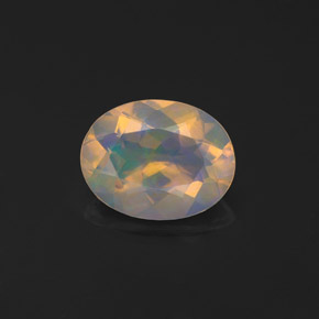 0.97カラットの天然マルチカラーオパール（9×7 mm・透明）