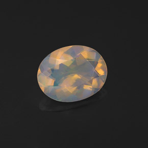 0.97カラットの天然マルチカラーオパール（9×7 mm・透明）