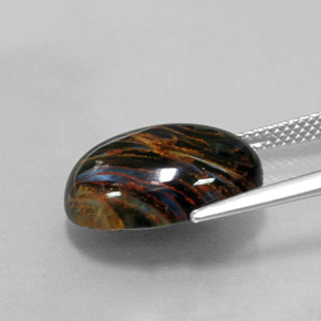 7.86カラットの天然マルチカラーピーターサイト、オーバルカット、オペーク