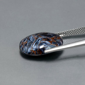 7.11カラットの天然マルチカラーピーターサイト、オーバルカット、オペーク