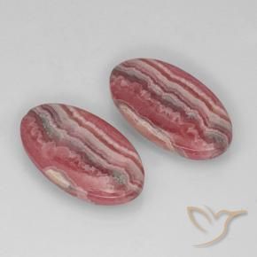 22.29カラットの天然マルチカラーロードクロサイト（19.7×11.2 mm・オーバルカット）