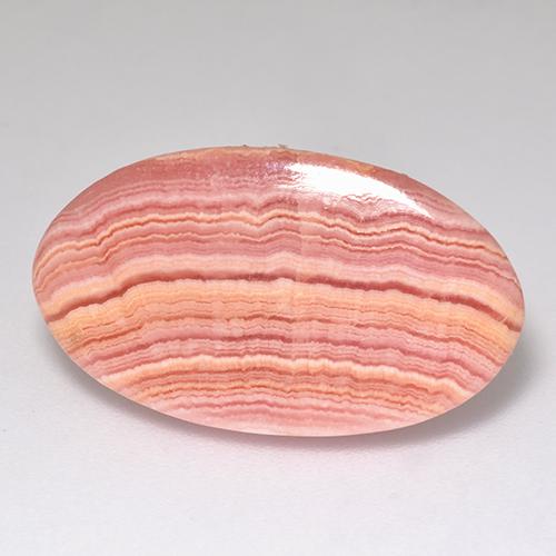 12.12カラットの天然マルチローズピンクロードクロサイト（23×13.2 mm・オーバルカット）