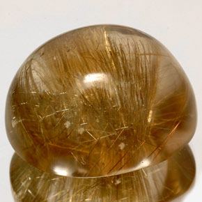 128.20カラットの天然無色＆ゴールドルチルクォーツ（31.8×26.5 mm・透明）