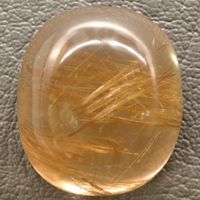 48.93カラットの天然無色＆ゴールドルチルクォーツ（23.2×20.2 mm・透明）
