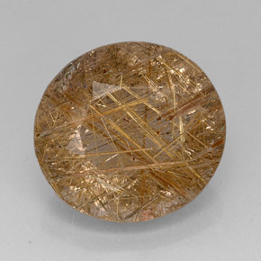 28.74カラットの天然無色＆ゴールドルチルクォーツ（21.5×20.1 mm・透明）