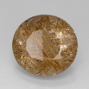 28.74カラットの天然無色＆ゴールドルチルクォーツ（21.5×20.1 mm・透明）
