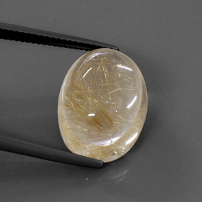 14.22カラットの天然無色＆ゴールドルチルクォーツ（18.2×13.4 mm・オーバルカット）