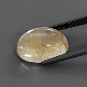 14.22カラットの天然無色＆ゴールドルチルクォーツ（18.2×13.4 mm・オーバルカット）