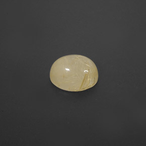 1.63カラットの天然無色＆ゴールドルチルクォーツ（8×6.3 mm・透明）