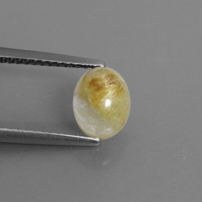 1.46カラットの天然無色＆ゴールドルチルクォーツ（7.8×6.2 mm・透明）
