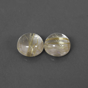 カラットの天然無色＆ゴールドルチルクォーツ（7.12 mm・ラウンドカット）