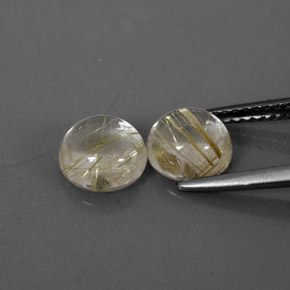 カラットの天然無色＆ゴールドルチルクォーツ（7.12 mm・ラウンドカット）