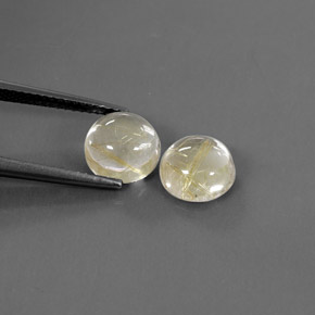 カラットの天然無色＆ゴールドルチルクォーツ（8.04 mm・ラウンドカット）