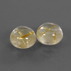 カラットの天然無色＆ゴールドルチルクォーツ（7.13 mm・ラウンドカット）