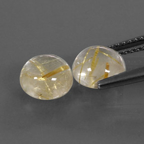 カラットの天然無色＆ゴールドルチルクォーツ（7.13 mm・ラウンドカット）