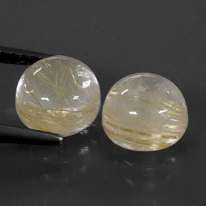 カラットの天然無色＆ゴールドルチルクォーツ（7.06 mm・ラウンドカット）