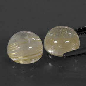 カラットの天然無色＆ゴールドルチルクォーツ（7.06 mm・ラウンドカット）