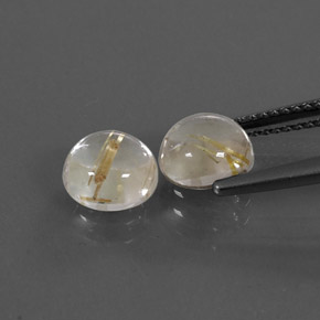 カラットの天然無色＆ゴールドルチルクォーツ（7.13 mm・ラウンドカット）
