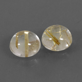 カラットの天然無色＆ゴールドルチルクォーツ（7.09 mm・ラウンドカット）