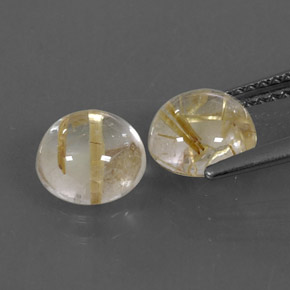 カラットの天然無色＆ゴールドルチルクォーツ（7.09 mm・ラウンドカット）