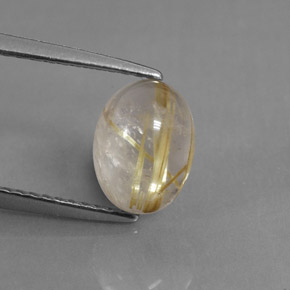 1.75カラットの天然無色＆ゴールドルチルクォーツ（8.6×6.5 mm・透明）