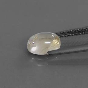 1.41カラットの天然無色＆ゴールドルチルクォーツ（8.2×6 mm・オーバルカット）