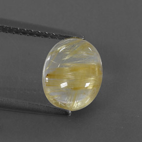 1.65カラットの天然無色＆ゴールドルチルクォーツ（9×7.1 mm・透明）