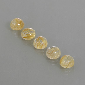 カラットの天然無色＆ゴールドルチルクォーツ（6.97 mm・ラウンドカット）