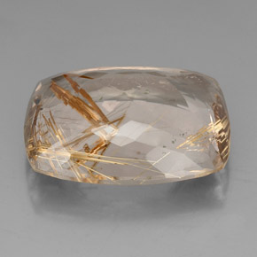 64.50カラットの天然無色＆ゴールドルチルクォーツ（29.9×24.5 mm・クッションカット）