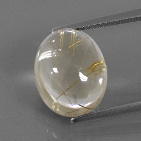 7.12カラットの天然無色＆ゴールドルチルクォーツ（12.3×10 mm・オーバルカット）